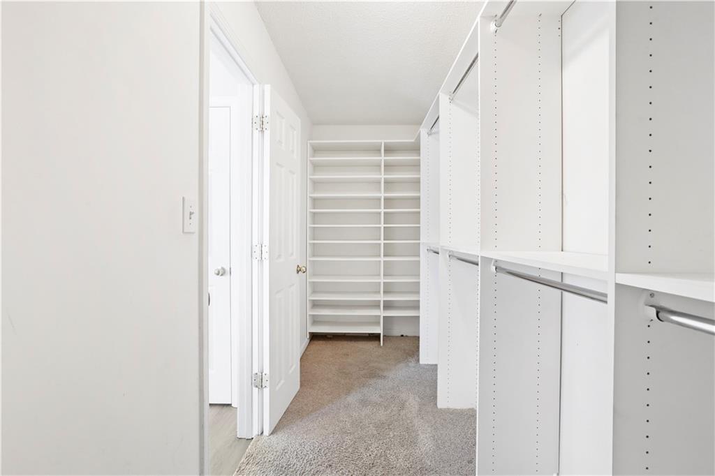 1300 Sunflower Court Locust Grove, GA 30248 - Photo 21 of 24 a view of closet area with empty racks