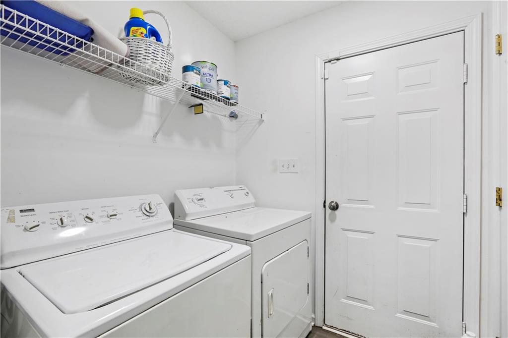1300 Sunflower Court Locust Grove, GA 30248 - Photo 22 of 24 a utility room with dryer and washer