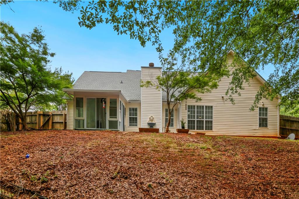 1300 Sunflower Court Locust Grove, GA 30248 - Photo 23 of 24 front view of a house with a tree