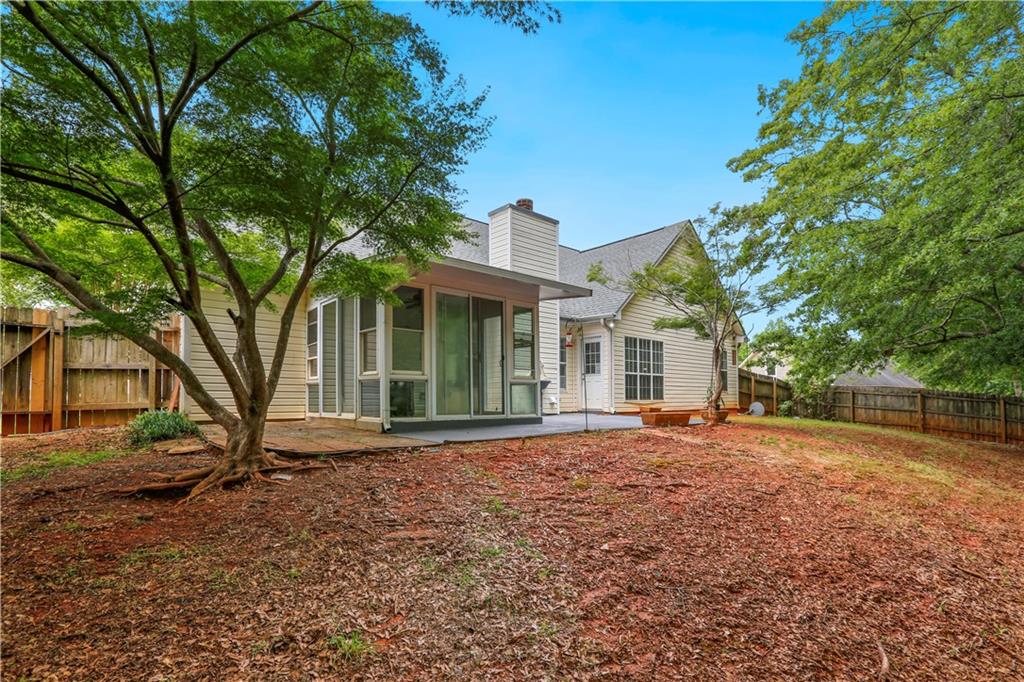 1300 Sunflower Court Locust Grove, GA 30248 - Photo 24 of 24 a front view of a house with a garden