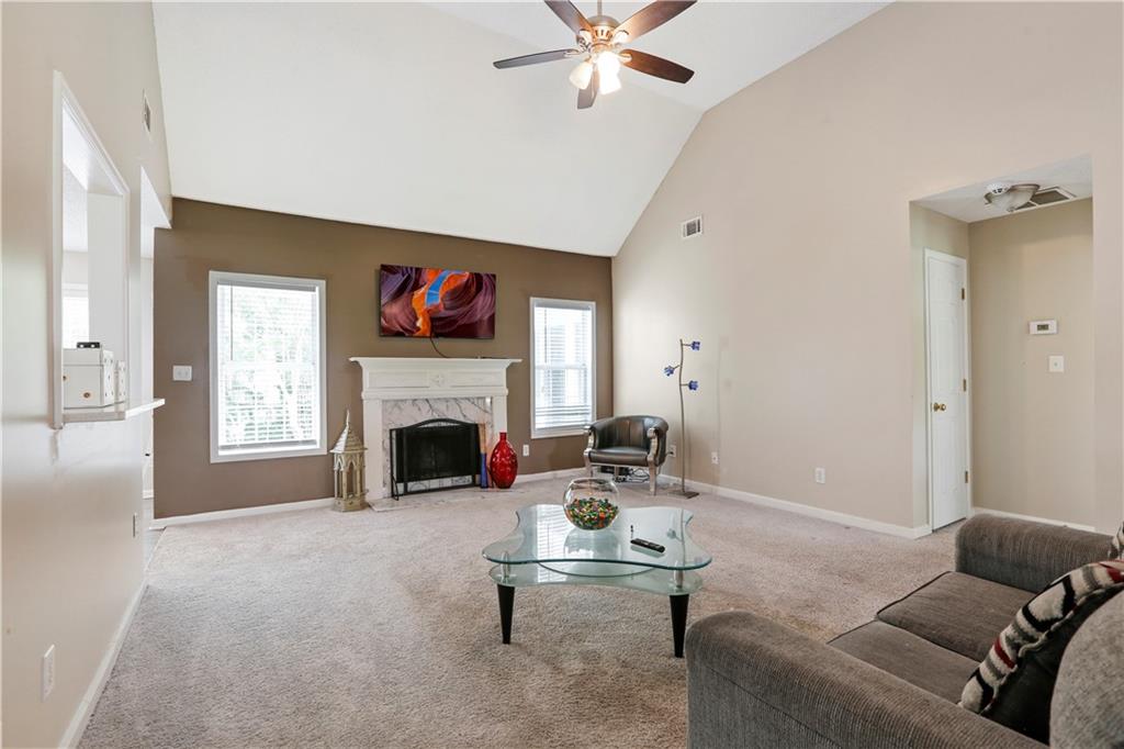 1300 Sunflower Court Locust Grove, GA 30248 - Photo 5 of 24 a living room with furniture and a fireplace