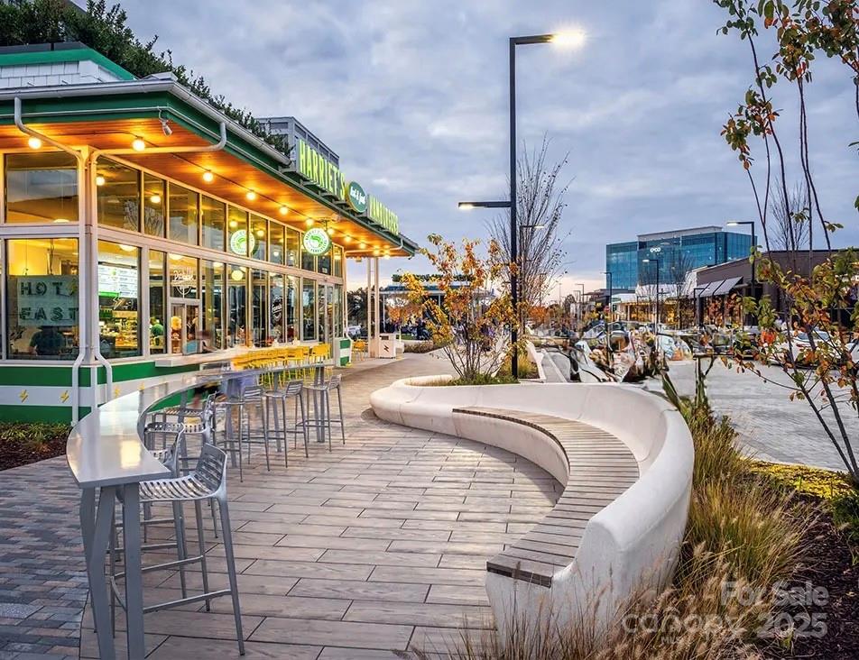 4334 Durango Drive, Unit 265 Indian Land, SC 29707 - Photo 25 of 28 a swimming pool with outdoor seating and yard