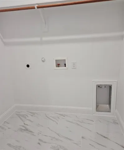 a front view of house with yard and trees around