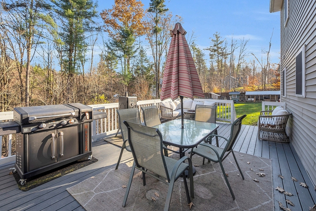 261 Bean Porridge Hill Road Westminster, MA 01473 - Photo 13 of 33 a view of a dining tables and chairs in the patio