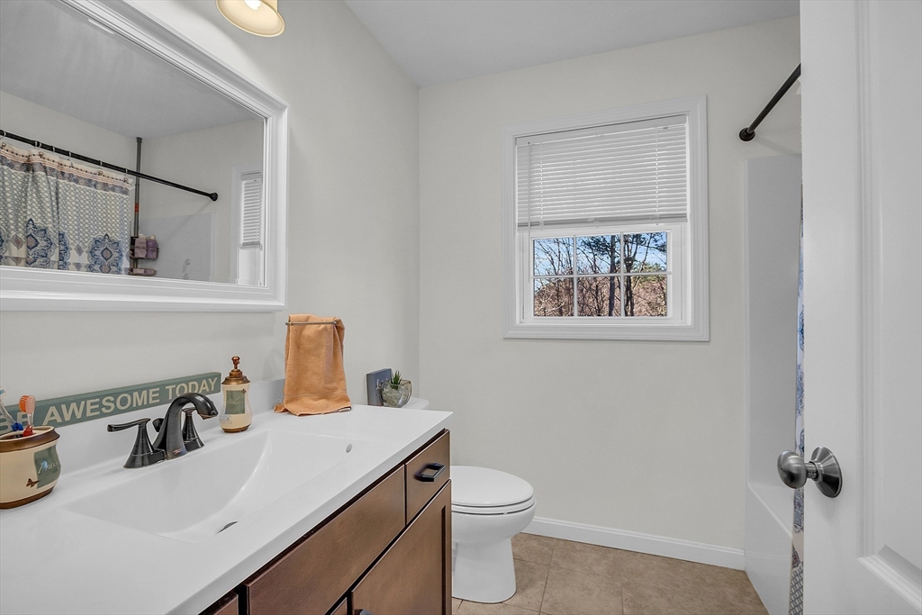 261 Bean Porridge Hill Road Westminster, MA 01473 - Photo 20 of 33 a bathroom with a sink a toilet and mirror