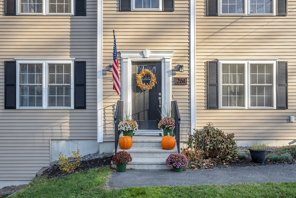 261 Bean Porridge Hill Road Westminster, MA 01473 - Photo 2 of 33 a front view of a house with porch and chairs