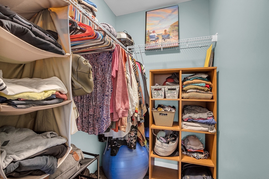 261 Bean Porridge Hill Road Westminster, MA 01473 - Photo 25 of 33 a view of walk in closet with clothes and shoes