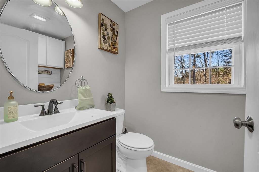 261 Bean Porridge Hill Road Westminster, MA 01473 - Photo 28 of 33 a bathroom with a toilet a sink and mirror