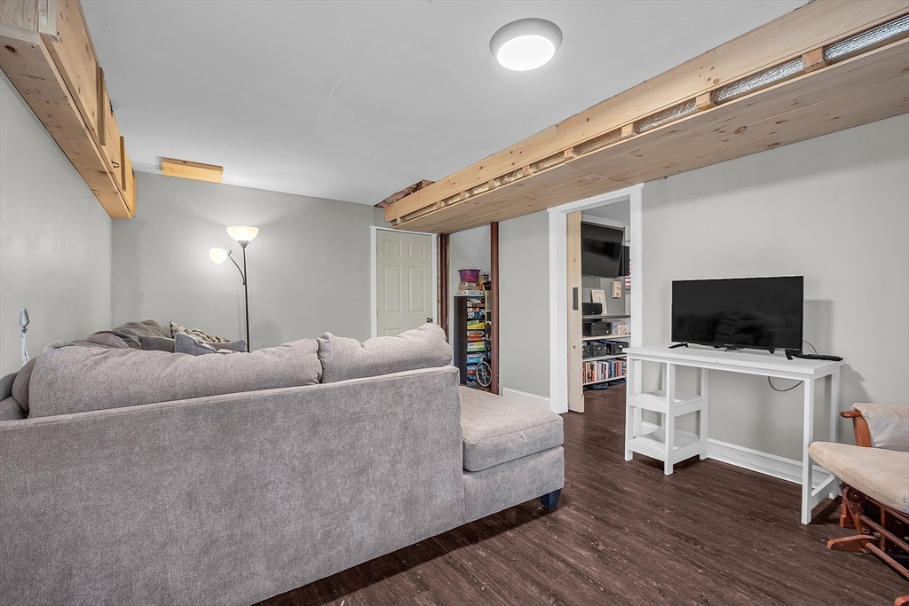 261 Bean Porridge Hill Road Westminster, MA 01473 - Photo 33 of 33 a living room with furniture and a flat screen tv