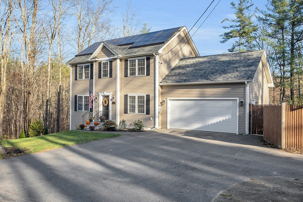 261 Bean Porridge Hill Road Westminster, MA 01473 - Photo 4 of 33 a front view of a house with a yard