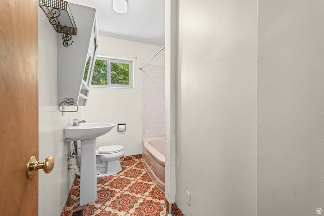 542 East 3400th Street North Provo, UT 84604 - Photo 18 of 39 Bathroom featuring a pedestal sink, patterned floor tiling, and a window