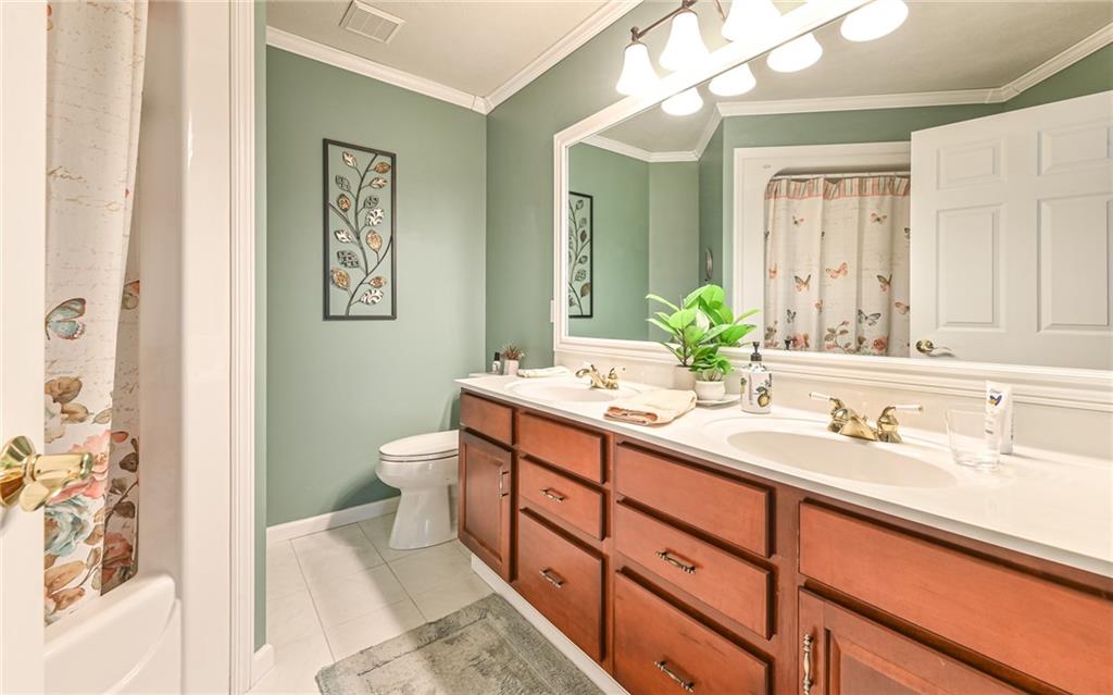 216 Sycamore Drive Seven Fields, PA 16046 - Photo 13 of 25 a bathroom with a double vanity sink mirror and toilet