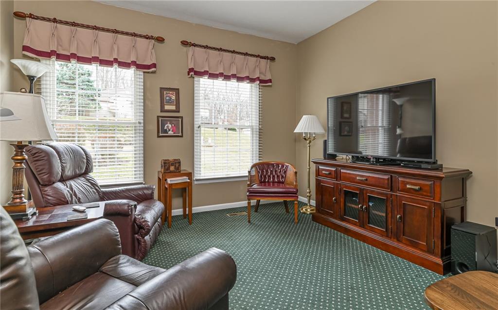 216 Sycamore Drive Seven Fields, PA 16046 - Photo 14 of 25 a living room with furniture and a flat screen tv