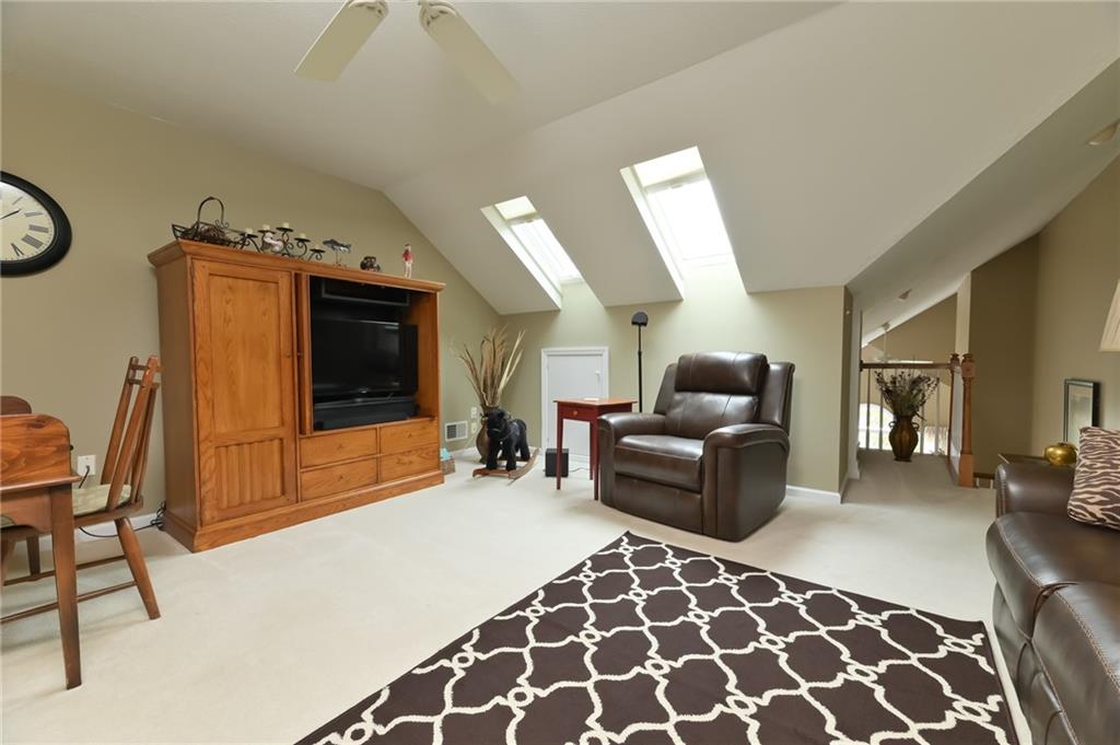 216 Sycamore Drive Seven Fields, PA 16046 - Photo 17 of 25 a living room with furniture and a flat screen tv