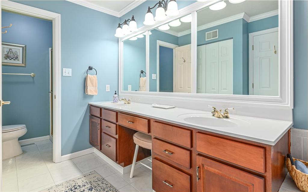 216 Sycamore Drive Seven Fields, PA 16046 - Photo 19 of 25 a bathroom with a sink and a mirror