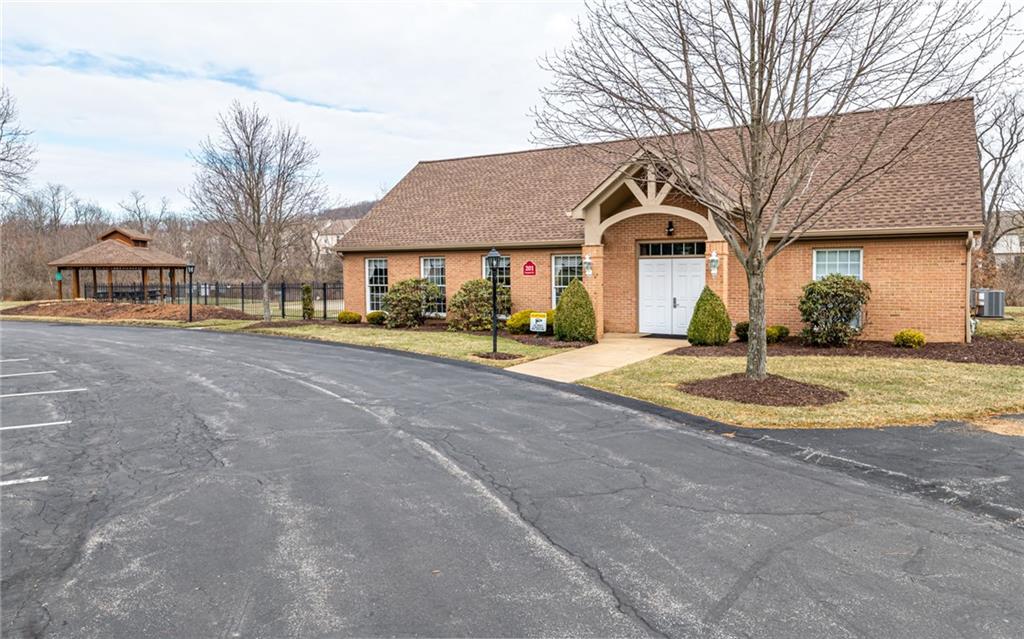 216 Sycamore Drive Seven Fields, PA 16046 - Photo 23 of 25 a front view of a house with a yard and garage