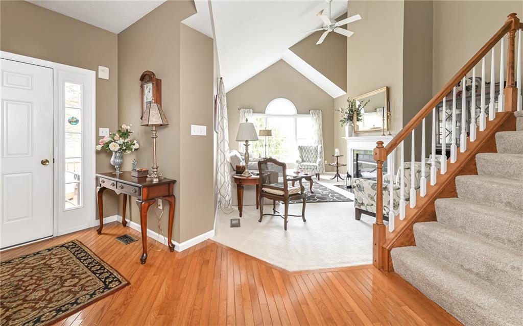 216 Sycamore Drive Seven Fields, PA 16046 - Photo 3 of 25 a dining room with wooden floor and a rug
