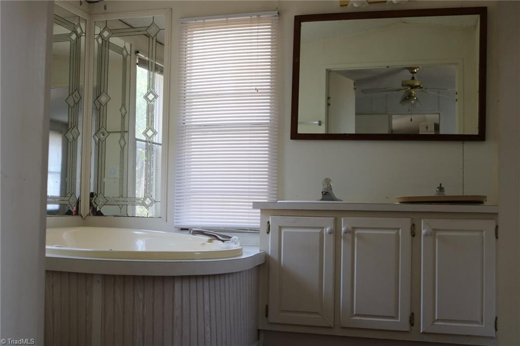 691 Epperson Church Road Mount Airy, NC 27030 - Photo 11 of 20 Master bath sink and tub