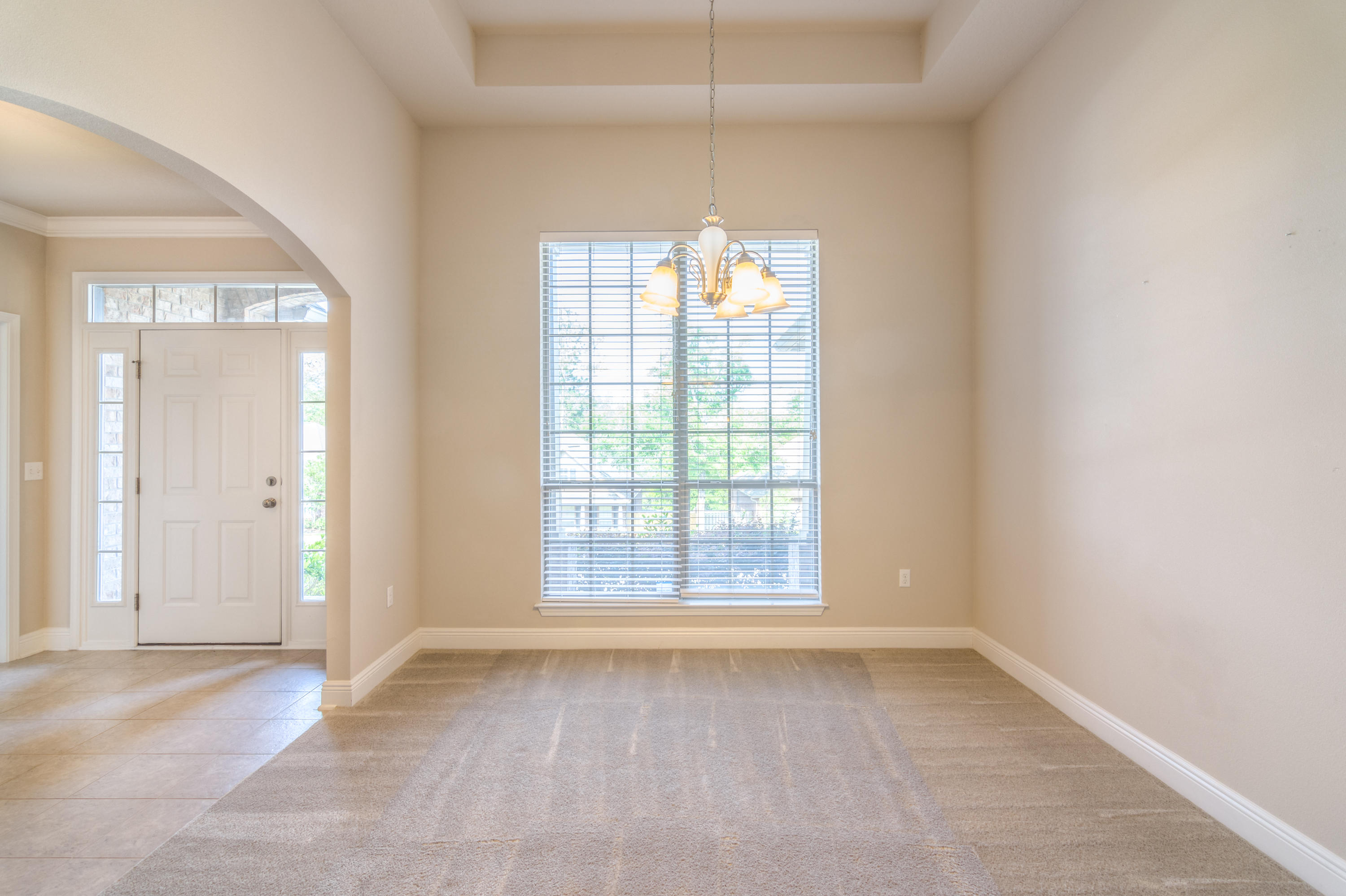 659 Red Fern Road Crestview, FL 32536 - Photo 9 of 35 an empty room with windows and entrance