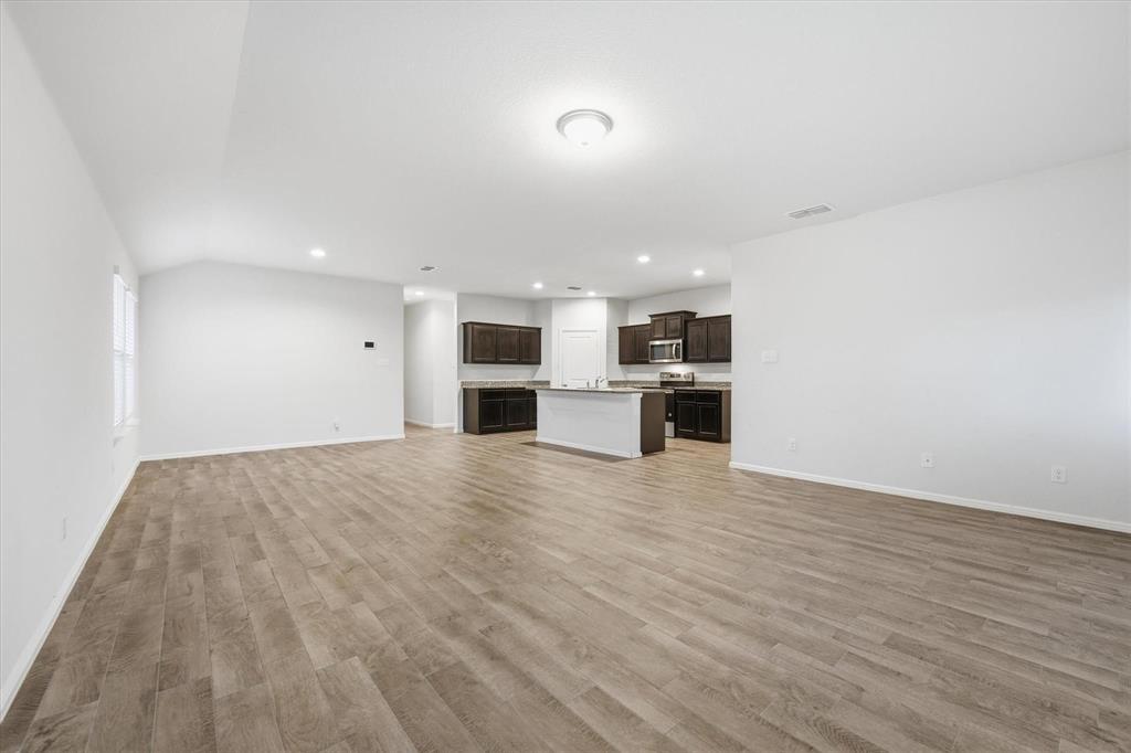 9308 Desertrock Road Fort Worth, TX 76131 - Photo 5 of 29 a view of kitchen with stainless steel appliances refrigerator and microwave