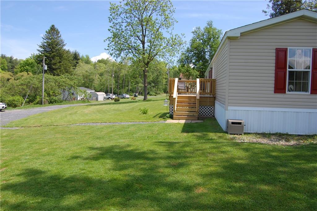 4053 Pioneer Lake Road Cherry Tree, PA 15724 - Photo 19 of 20 a backyard of a house with lots of green space