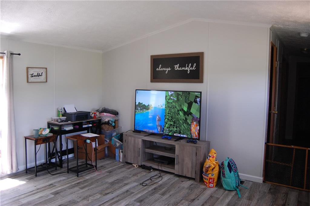 4053 Pioneer Lake Road Cherry Tree, PA 15724 - Photo 2 of 20 a view of a workspace with furniture and a window