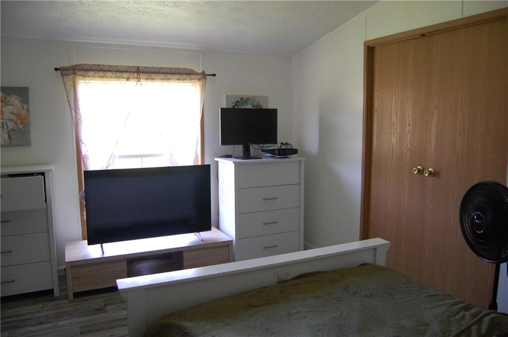 4053 Pioneer Lake Road Cherry Tree, PA 15724 - Photo 8 of 20 a room with a chair and a window