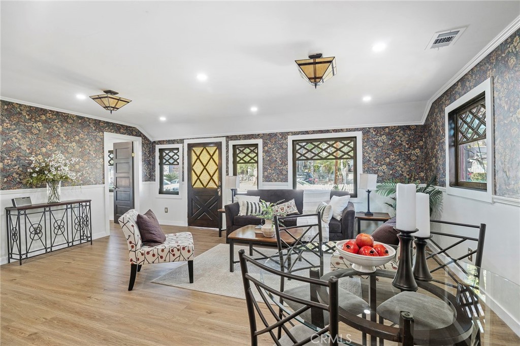 12428 Pasadena Street Whittier, CA 90601 - Photo 6 of 25 a living room with furniture and wooden floor