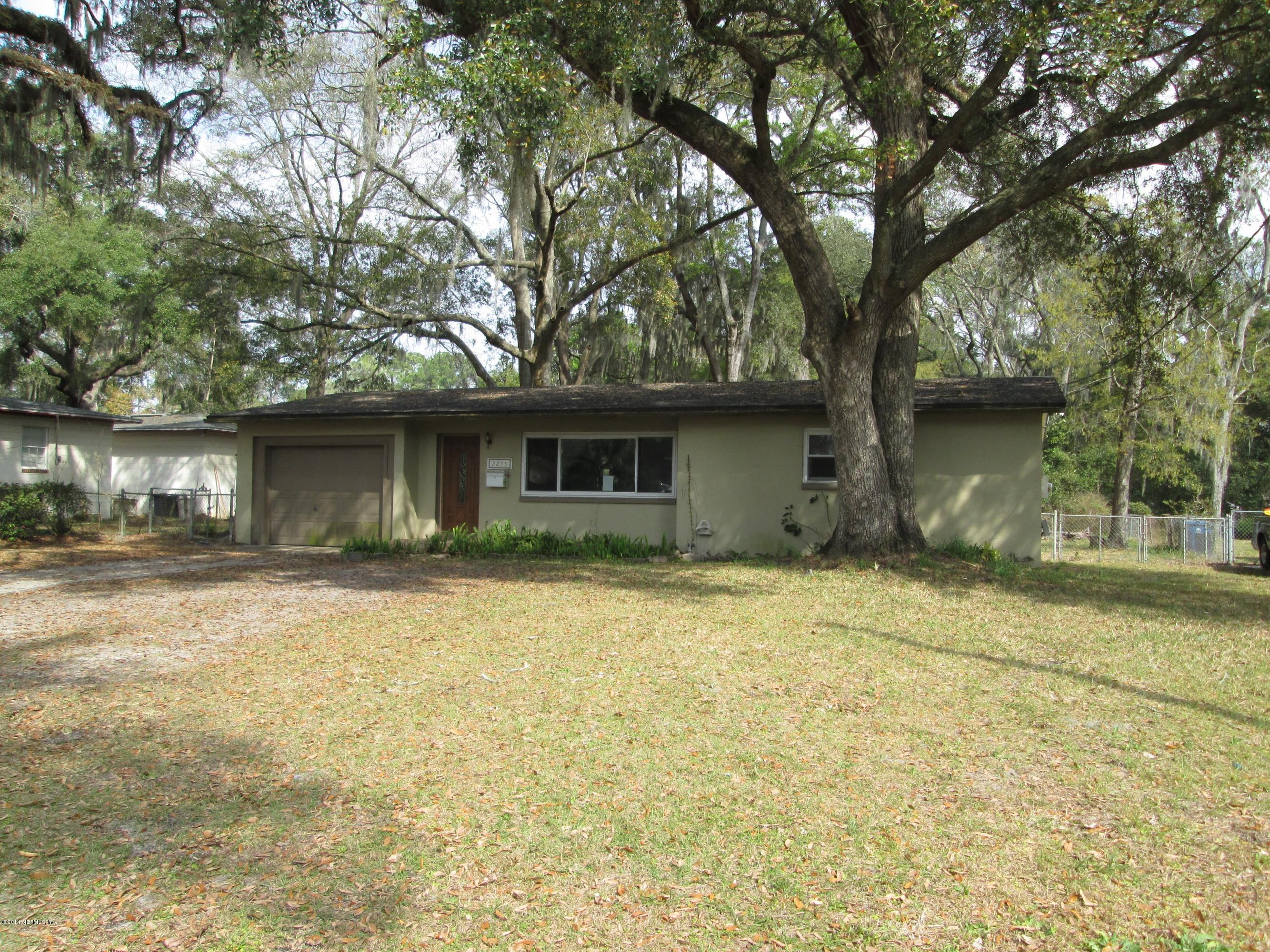 2235 Newberry Road Jacksonville, FL 32218 - Photo 1 of 12 a front view of a house with yard