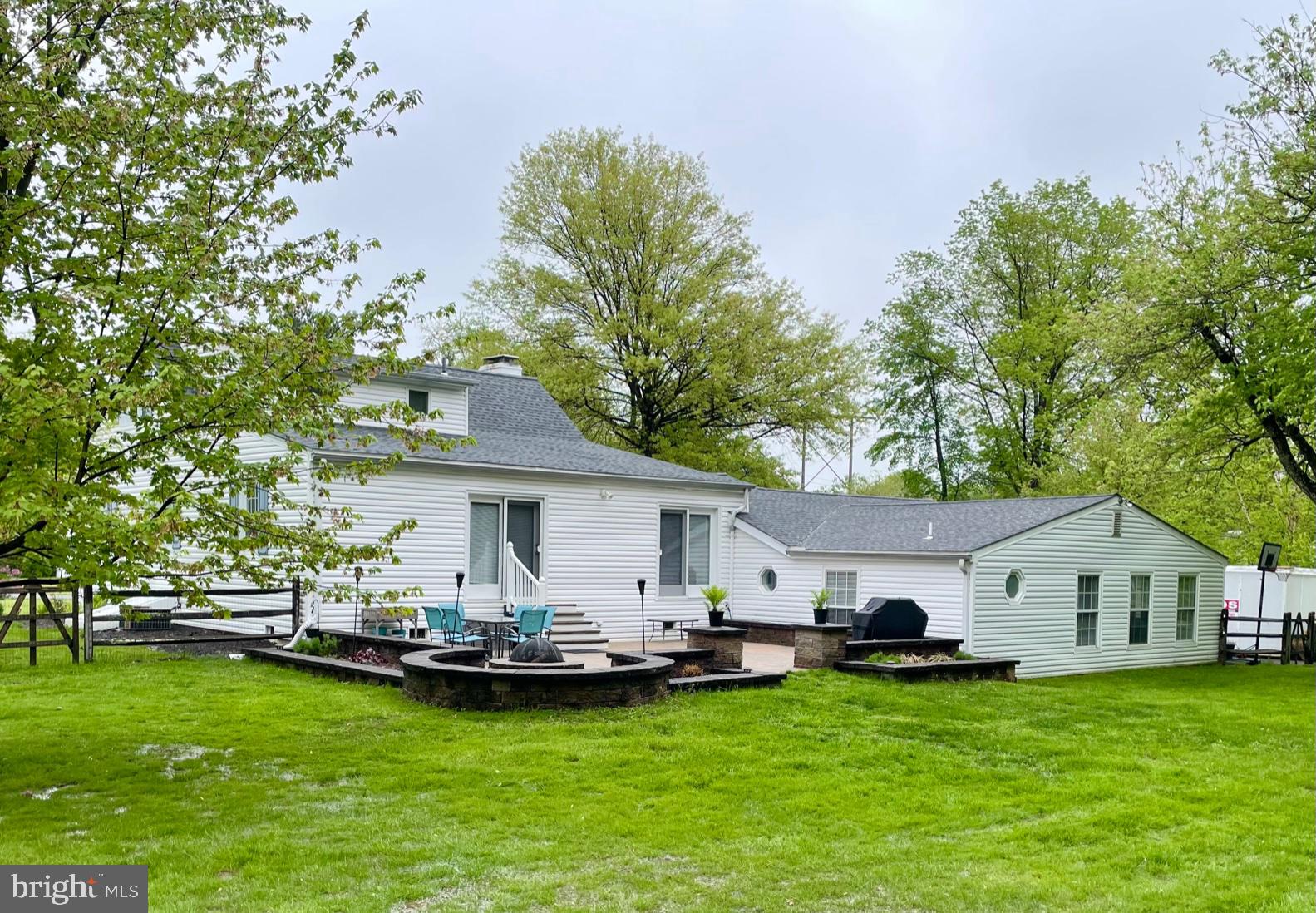 2112 Longview Road Warrington, PA 18976 - Photo 57 of 79 Rear of home with paved patio and firepit.