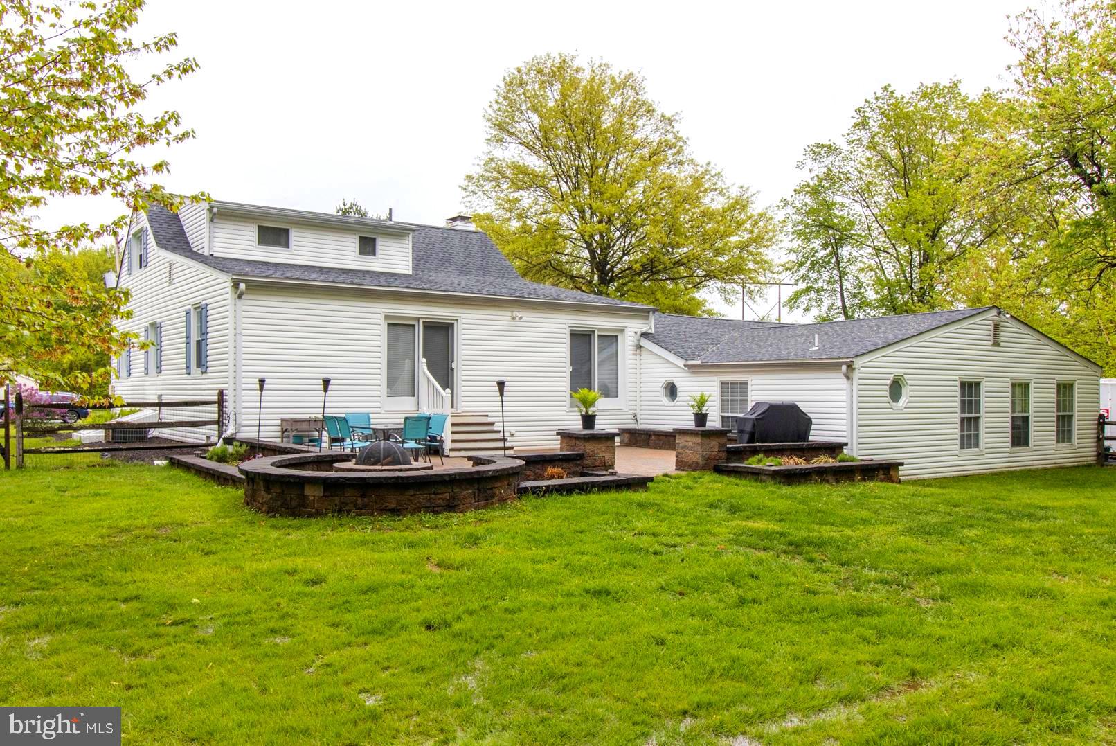 2112 Longview Road Warrington, PA 18976 - Photo 58 of 79 Rear of home with paved patio and firepit.