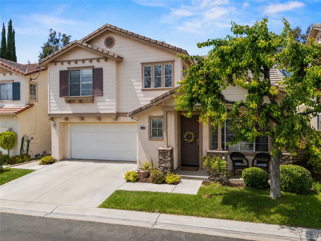 28033 Memory Lane Valencia, CA 91354 - Photo 1 of 40 a front view of a house with a yard and garage
