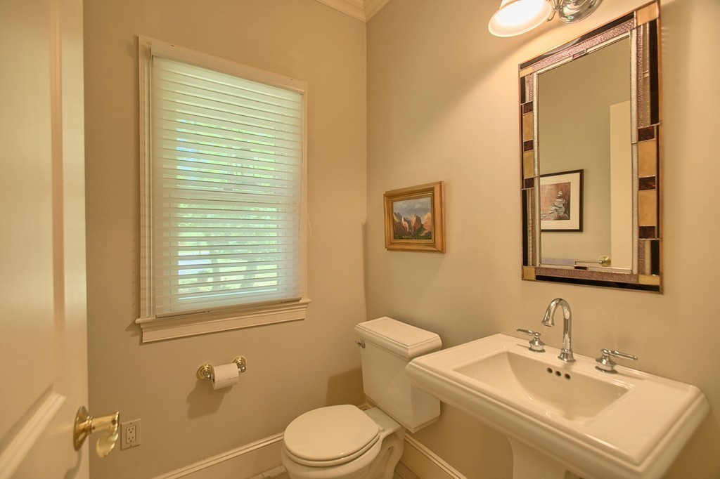 96 Forest Ridge Road, Unit 96 Concord, MA 01742 - Photo 11 of 24 a bathroom with a sink a toilet and mirror