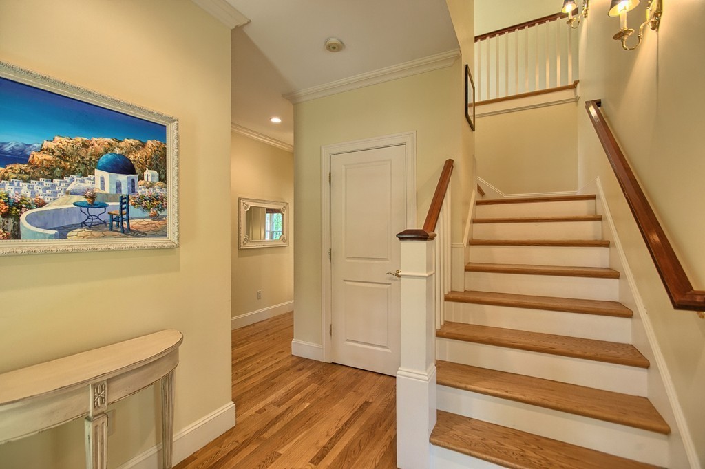 96 Forest Ridge Road, Unit 96 Concord, MA 01742 - Photo 4 of 24 a view of an entryway with wooden floor