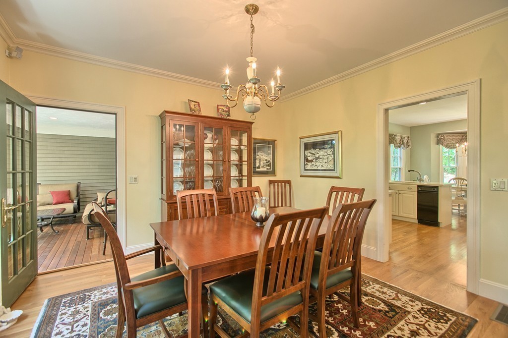 96 Forest Ridge Road, Unit 96 Concord, MA 01742 - Photo 9 of 24 a view of a dining room with furniture window and wooden floor