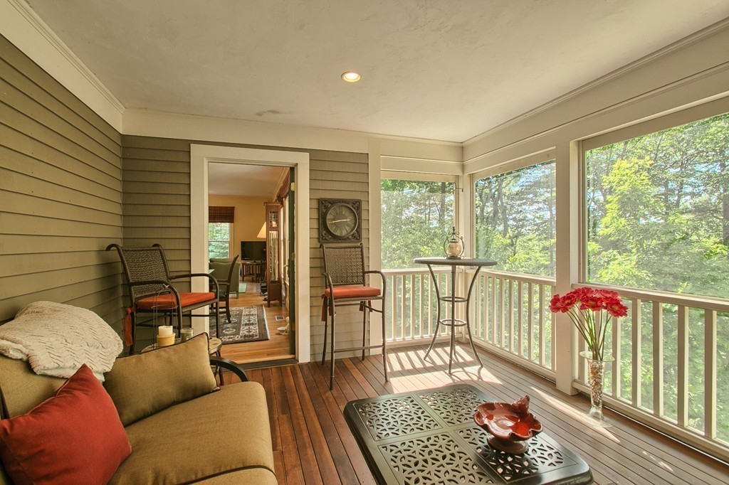 96 Forest Ridge Road, Unit 96 Concord, MA 01742 - Photo 10 of 24 a living room with furniture and a floor to ceiling window