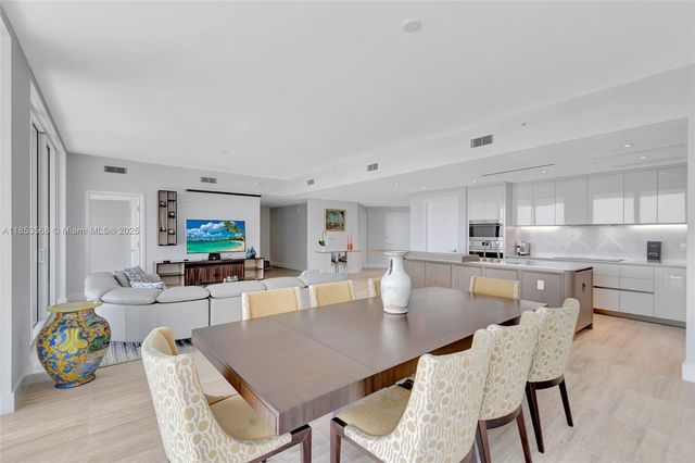 a view of kitchen dining table and chairs