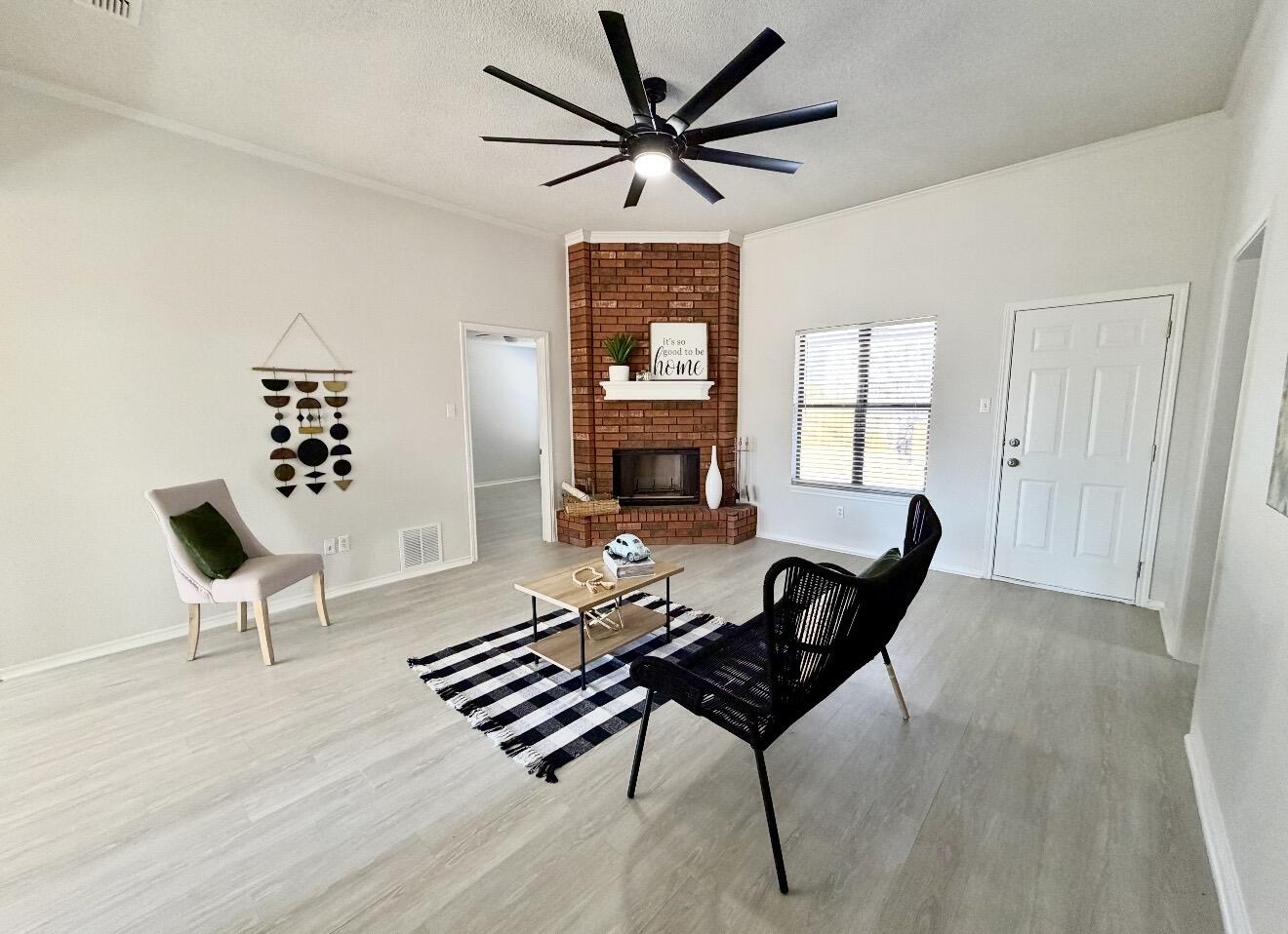2318 94th Street Lubbock, TX 79423 - Photo 9 of 19 a living room with furniture and a window