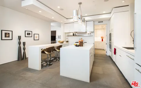 a kitchen with cabinets and white appliances