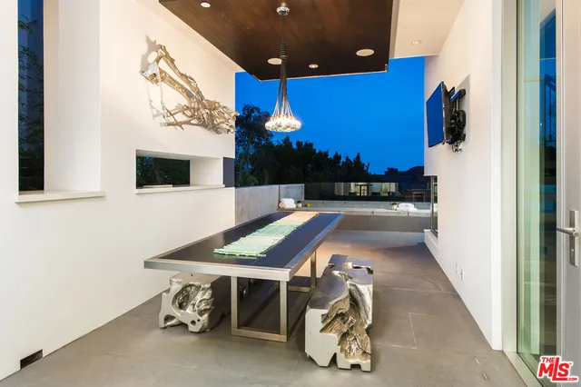 a room with pool table and a flat screen tv