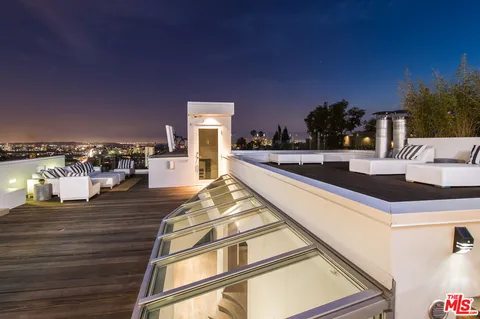 a view of a living room and kitchen with furniture and a kitchen counter