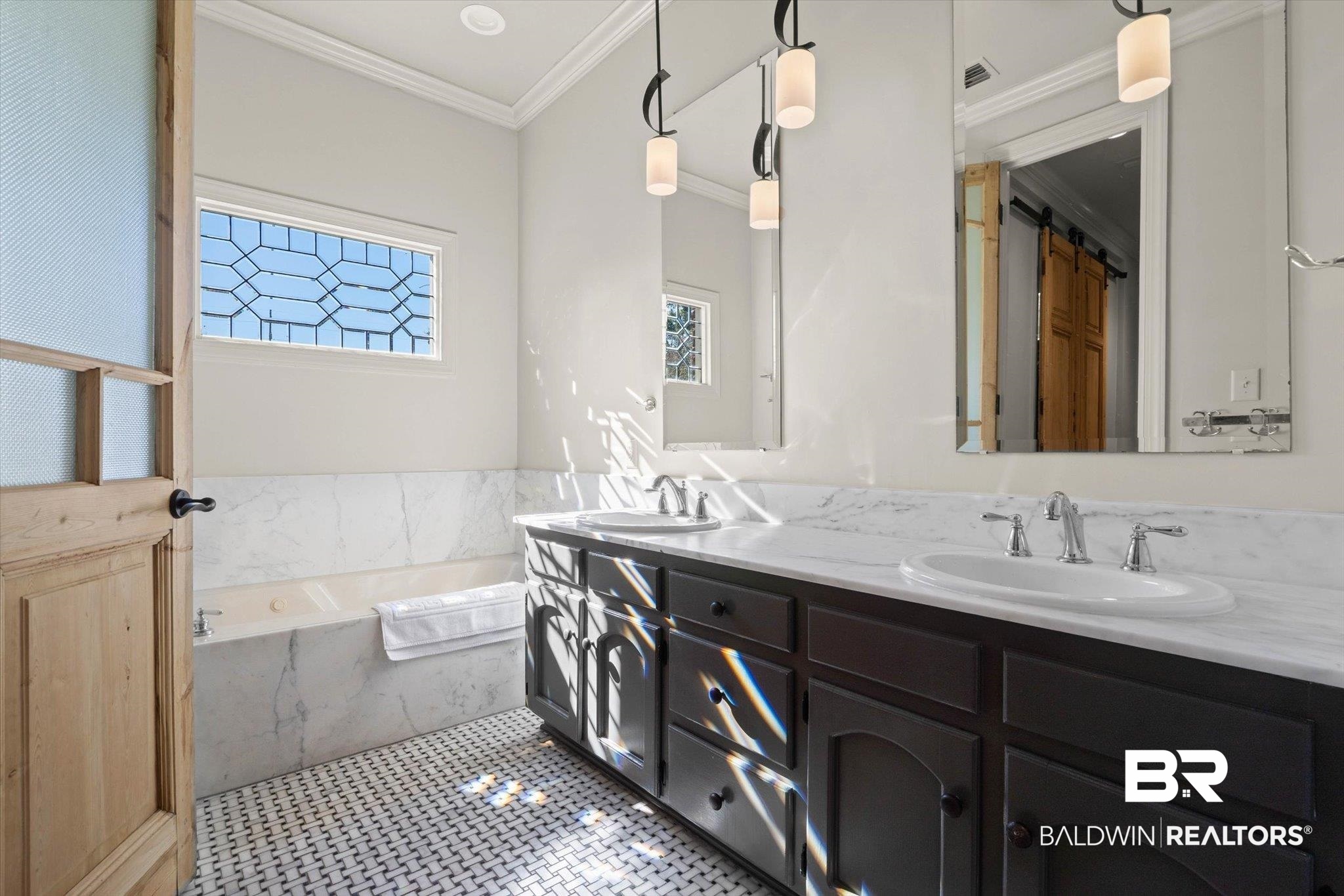 3615 Stein Street Mobile, AL 36608 - Photo 23 of 44 Full bath featuring a garden tub, double vanity, crown molding, and dark tile patterned flooring