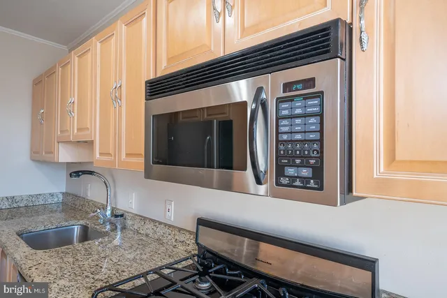 a kitchen with a sink and a window