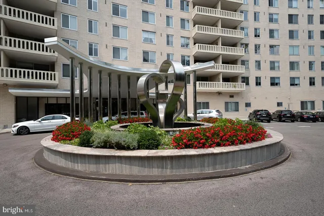a lobby with furniture and a potted plant