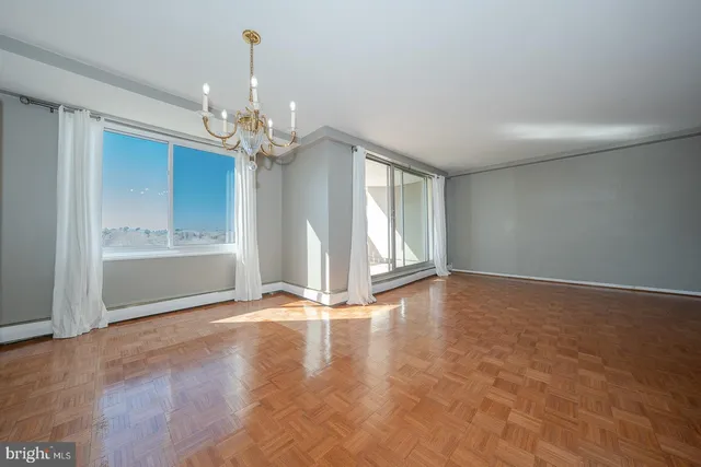 a view of an empty room with a window