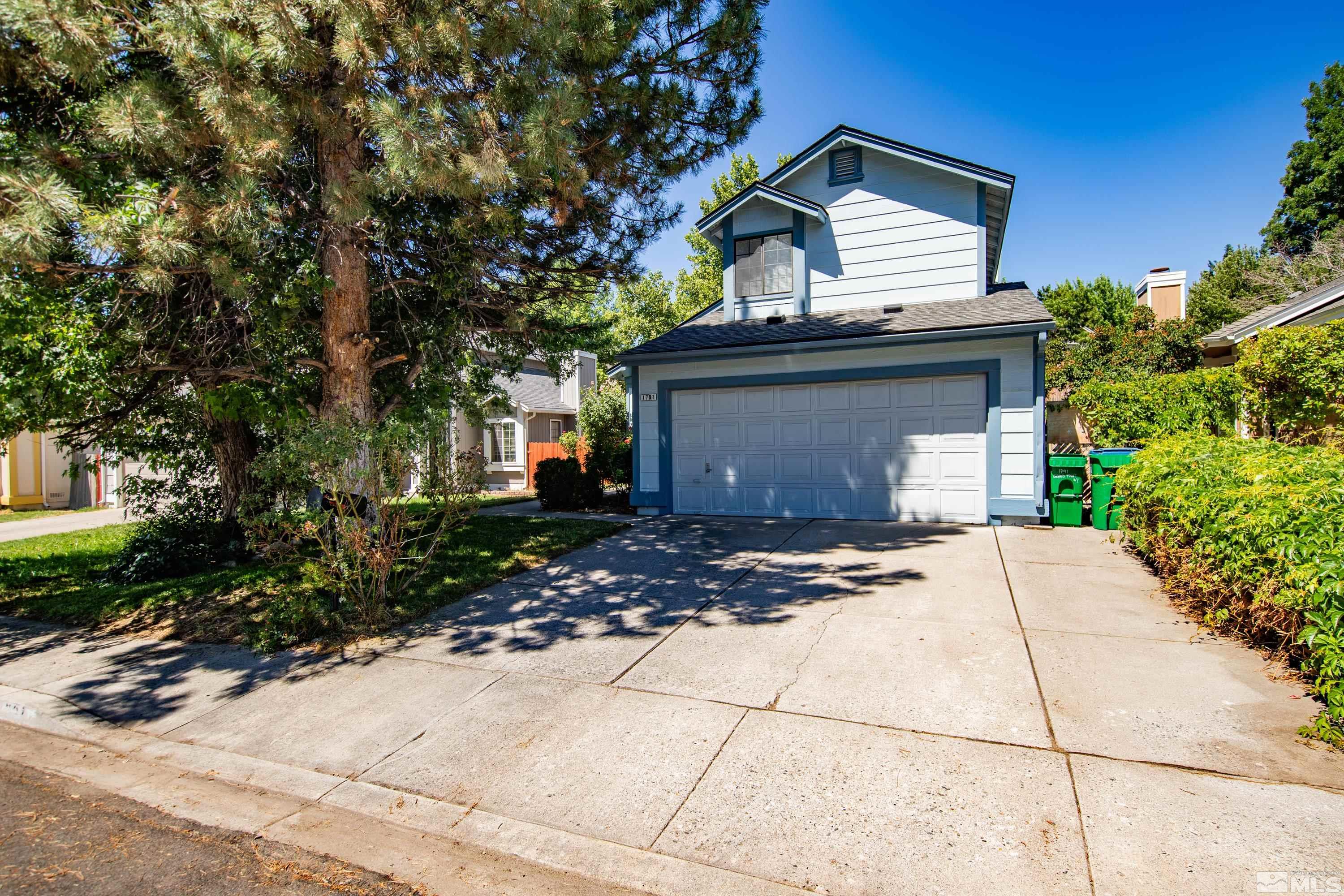 1791 Grand Point Way Reno, NV 89523 - Photo 2 of 24 a front view of a house with a yard