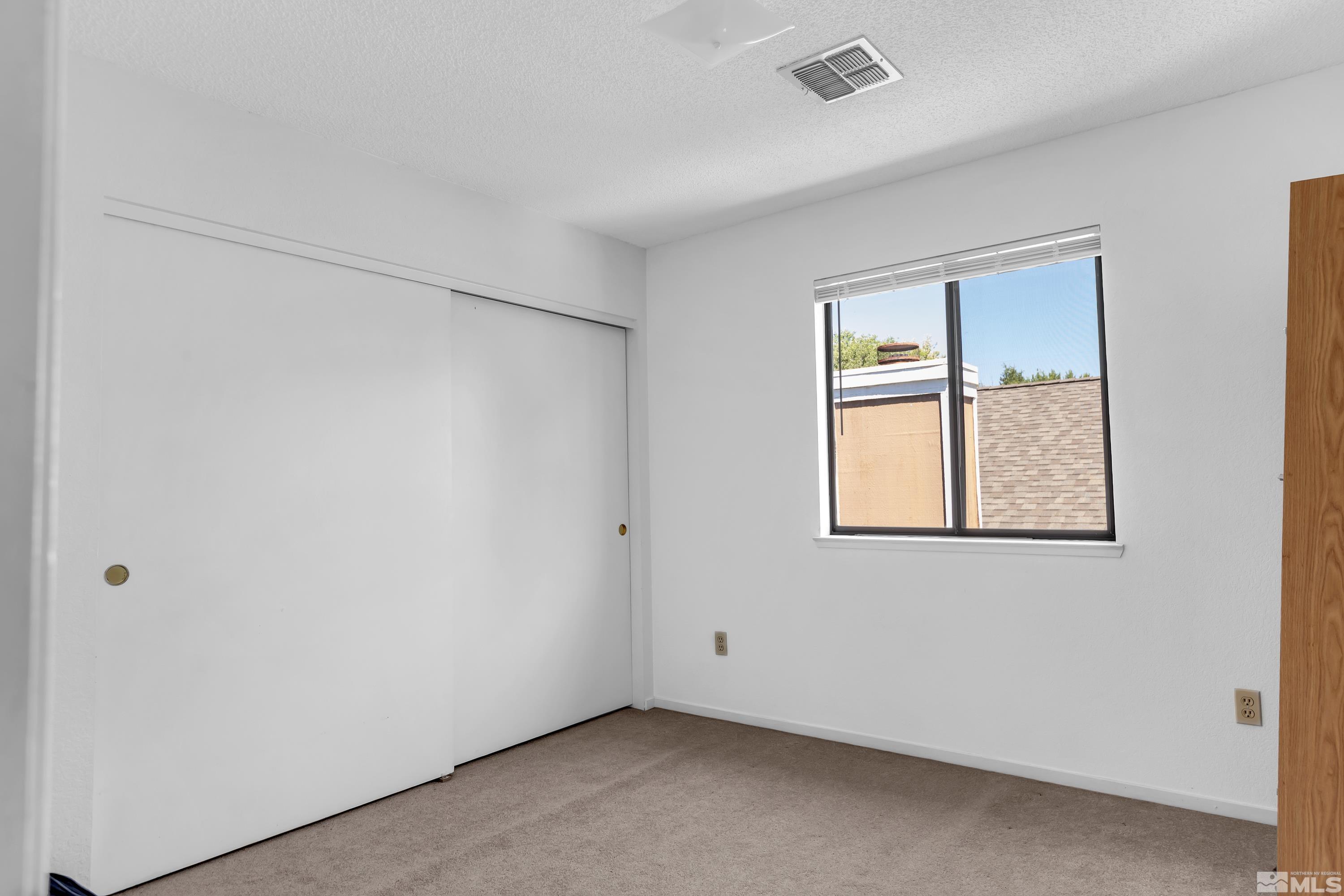 1791 Grand Point Way Reno, NV 89523 - Photo 23 of 24 an empty room with a window