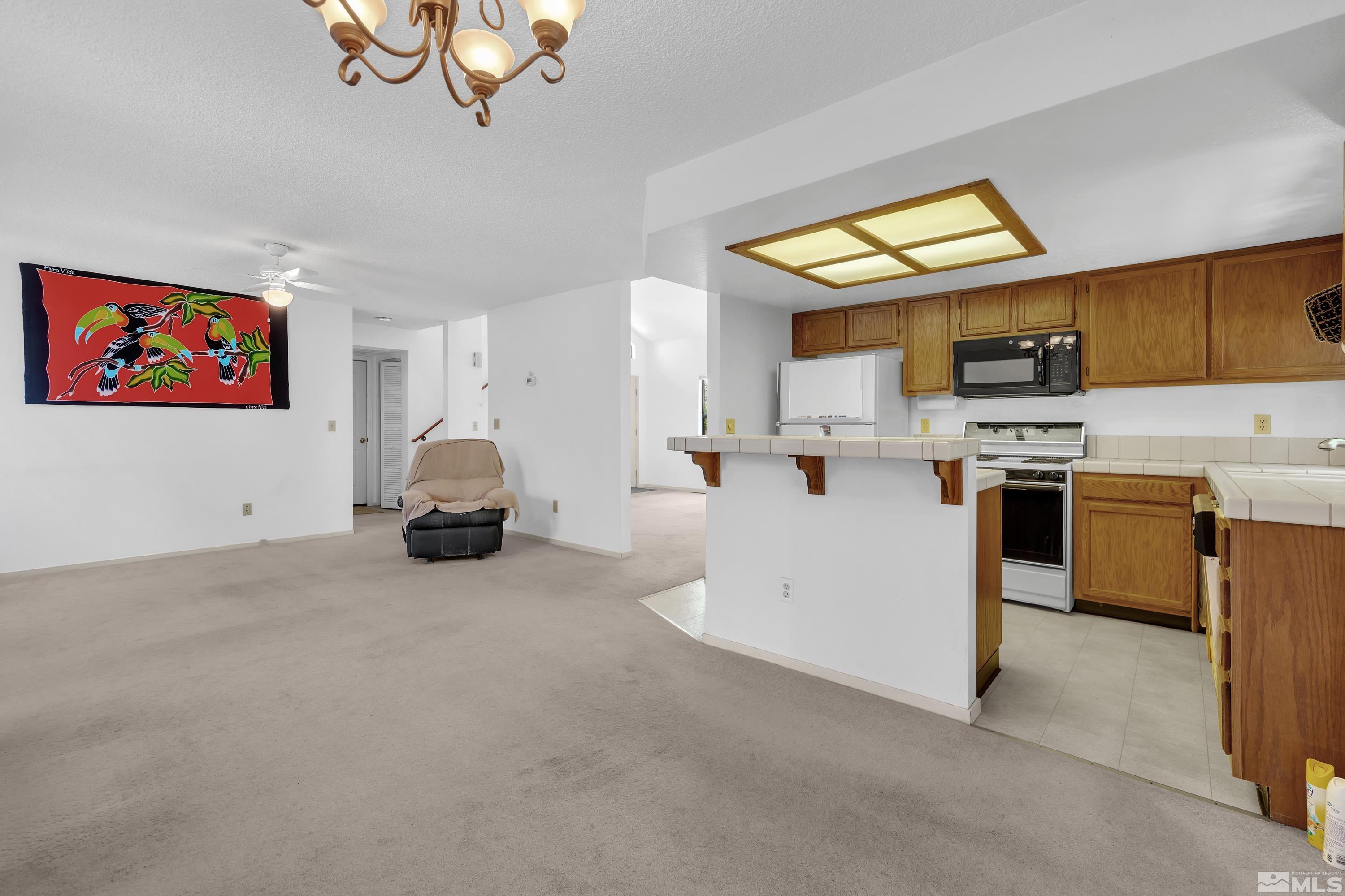1791 Grand Point Way Reno, NV 89523 - Photo 7 of 24 a view of kitchen with furniture and electronic appliances