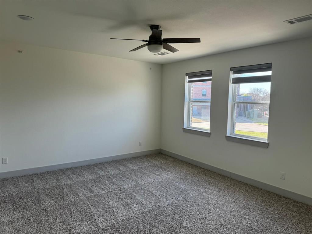 6043 Rivendell Drive Frisco, TX 75035 - Photo 12 of 21 a view of an empty room with a window