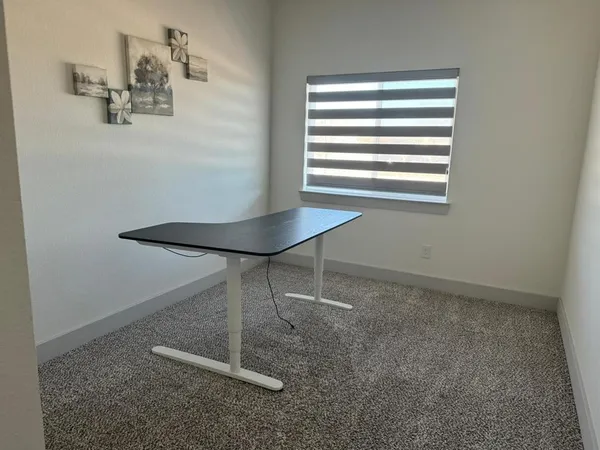 a room with a window and a table